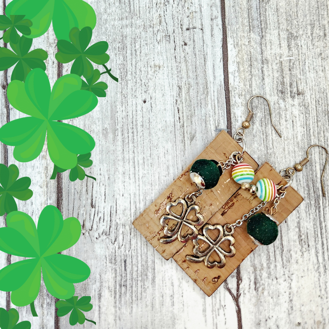 St. Patrick's Day earrings. A rose gold flecked cork on leather with rainbow and green velvet beads and fourleaf clover charms. 